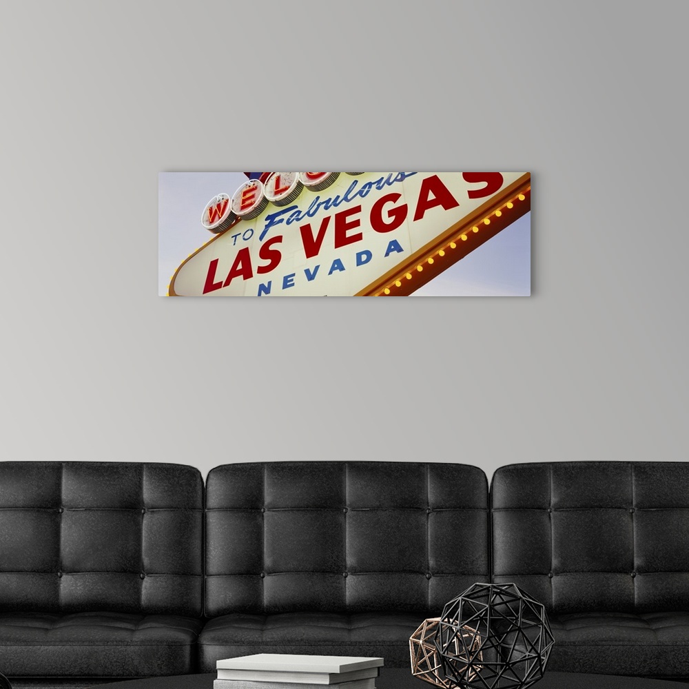 A modern room featuring Panoramic photo of a close up of the classic Las Vegas sign.
