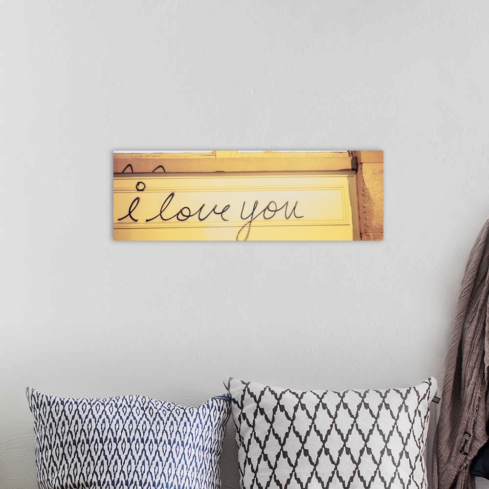 A bohemian room featuring Close-up of I love you written on a wall