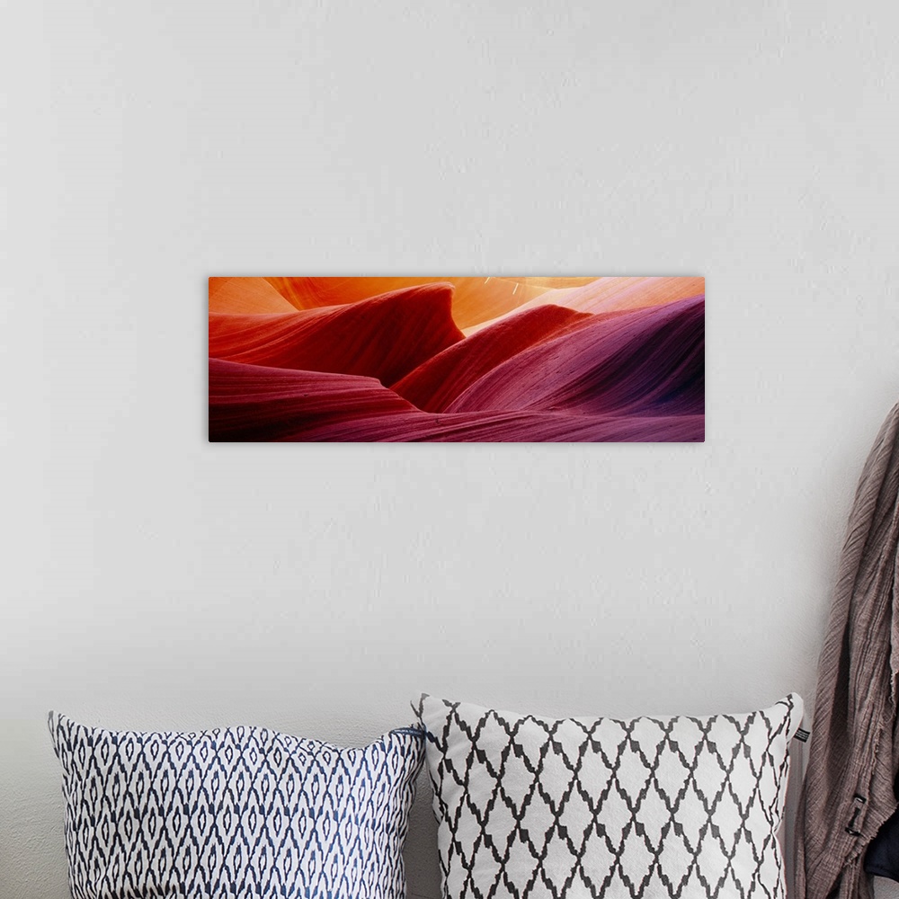 A bohemian room featuring Panoramic photograph of eroded rock in Antelope Canyon, with light forming wavy patters as it bou...