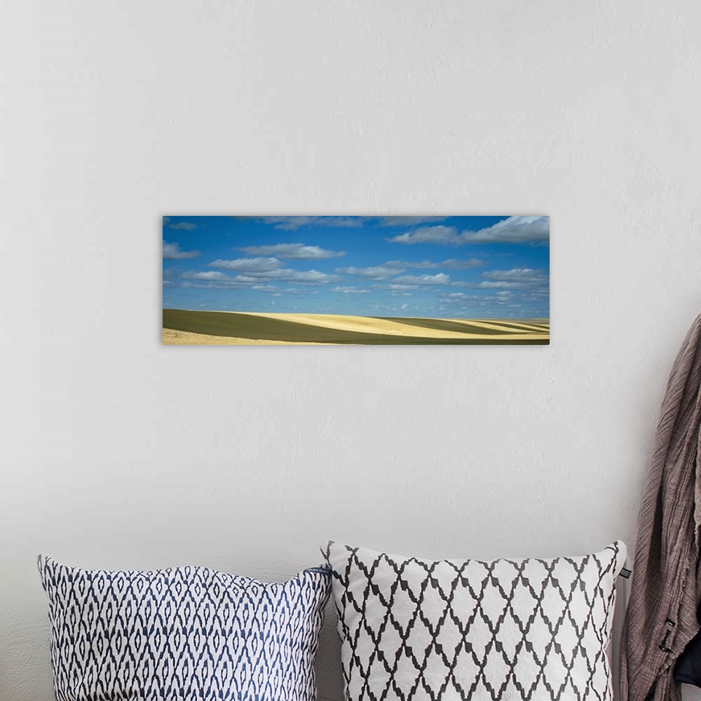 A bohemian room featuring Clouded sky over a striped field, Geraldine, Montana