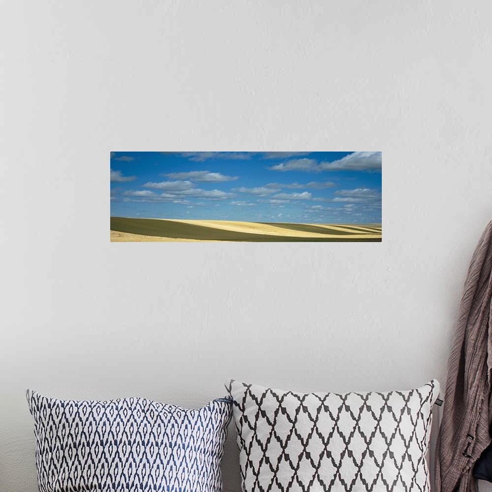 A bohemian room featuring Clouded sky over a striped field, Geraldine, Montana