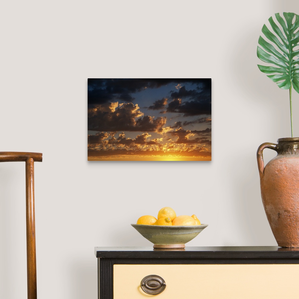 A traditional room featuring Horizontal photograph on a large canvas of a vibrant, golden sunset beneath a darkening sky full ...