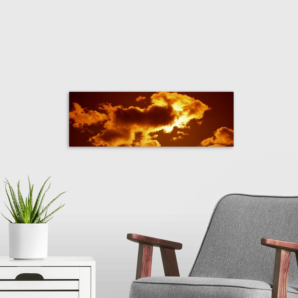 A modern room featuring Clouds and Sunset