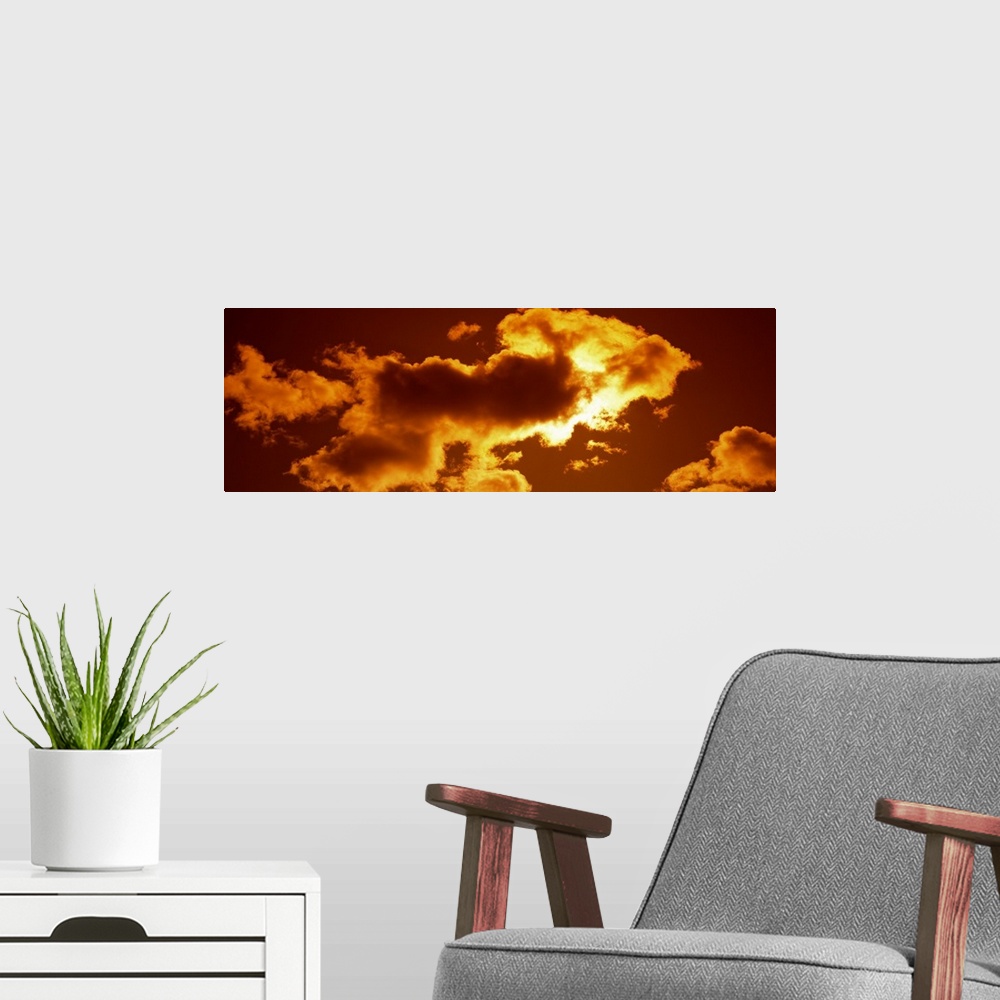 A modern room featuring Clouds and Sunset