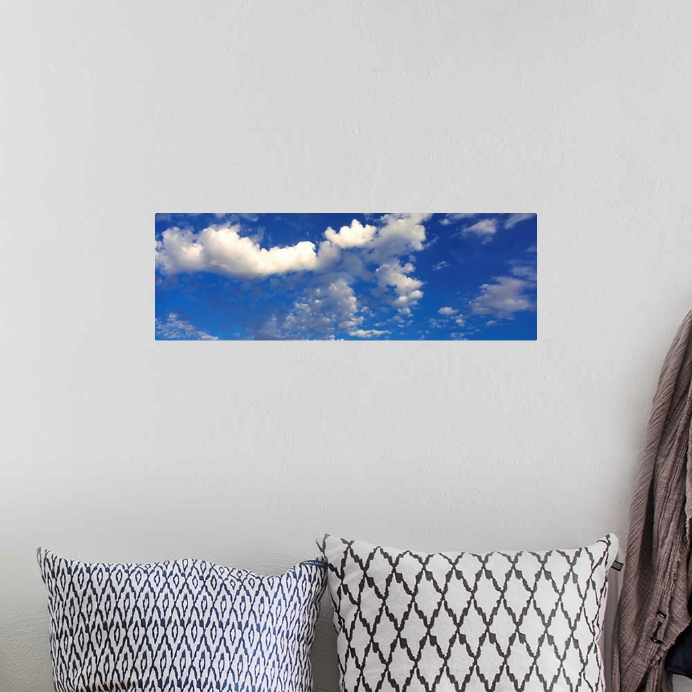 A bohemian room featuring Clouds in the sky