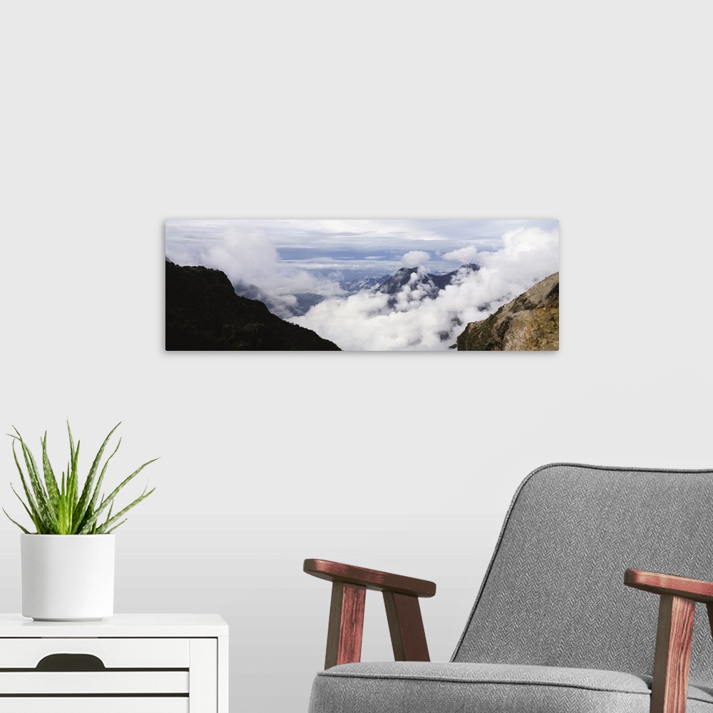 A modern room featuring Clouds near a mountain range, Mt Kilimanjaro, Tanzania
