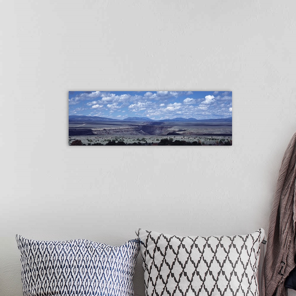 A bohemian room featuring Clouds over a landscape, Rio Grande Gorge, Taos, New Mexico