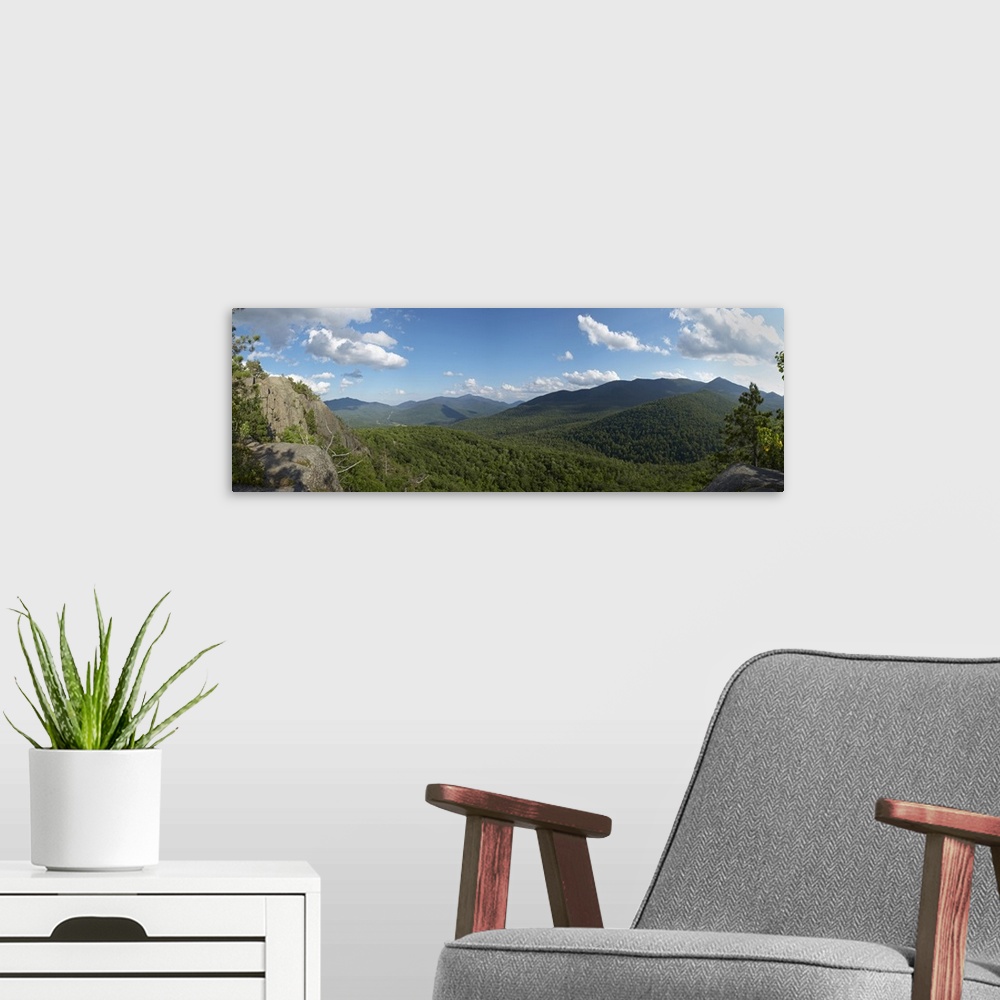 A modern room featuring Clouds over a mountain range, Adirondack Mountains, New York State