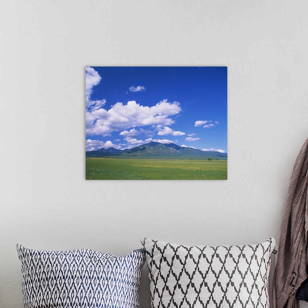 A bohemian room featuring Clouds over a mountain range, Taos, Taos County, New Mexico