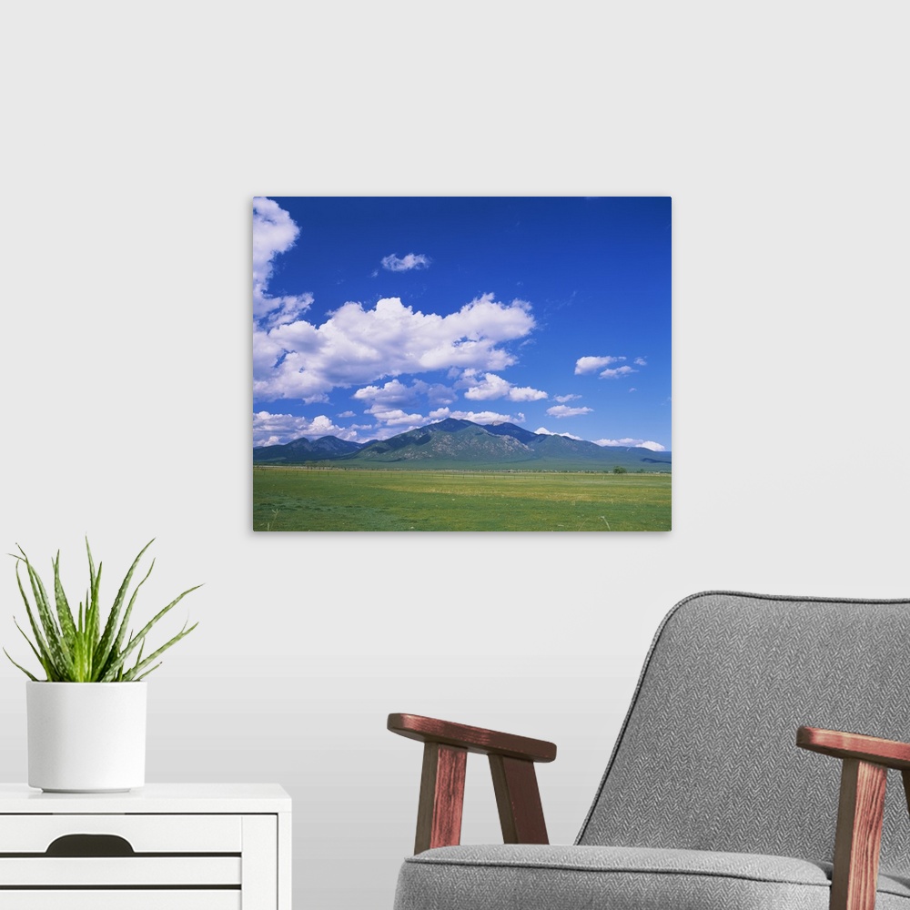 A modern room featuring Clouds over a mountain range, Taos, Taos County, New Mexico