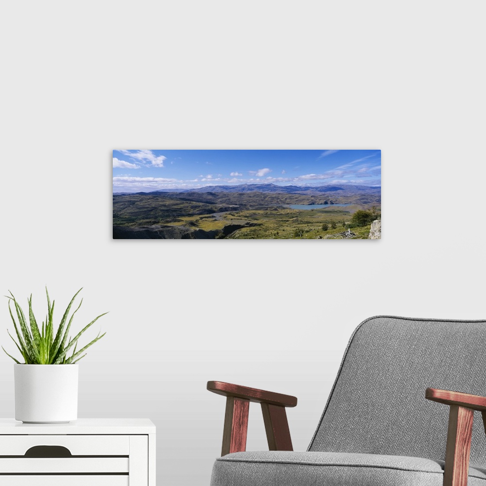 A modern room featuring Clouds over a mountain range, Torres Del Paine National Park, Patagonia, Chile