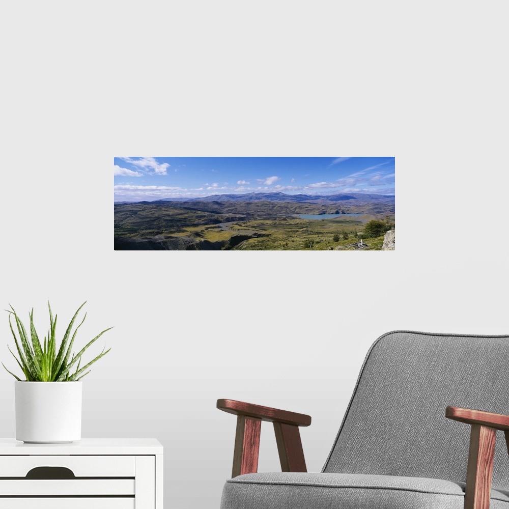 A modern room featuring Clouds over a mountain range, Torres Del Paine National Park, Patagonia, Chile