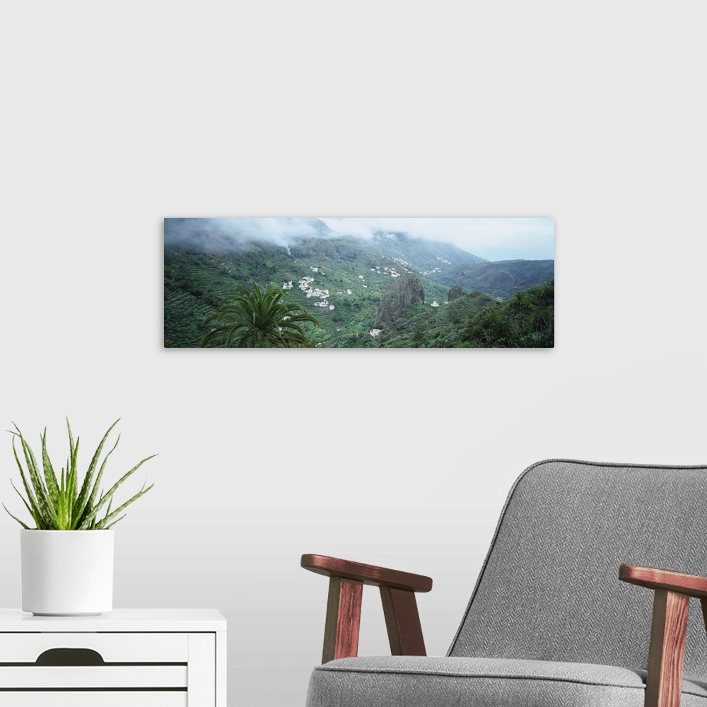 A modern room featuring Clouds over a rainforest, La Gomera, Canary Island, Spain