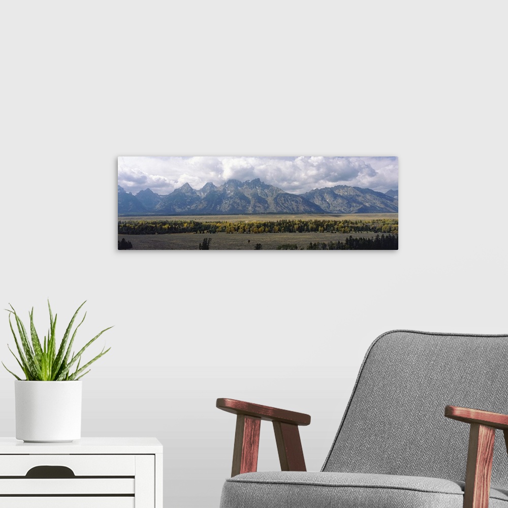 A modern room featuring Clouds over Grand Teton National Park WY