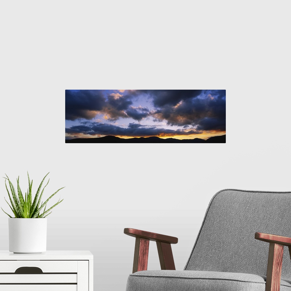 A modern room featuring Clouds over mountains at dusk, Stowe, Lamoille County, Vermont