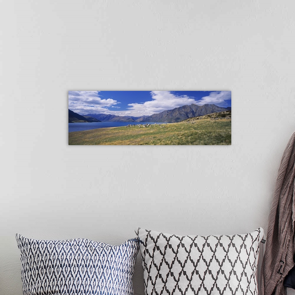 A bohemian room featuring Clouds over mountains, Lake Hawea, Otago, Wanaka, South Island, New Zealand