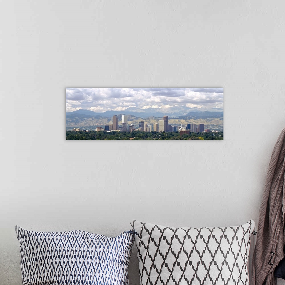 A bohemian room featuring Panoramic photograph shows a line of skyscrapers in a capital city within the Midwestern United S...
