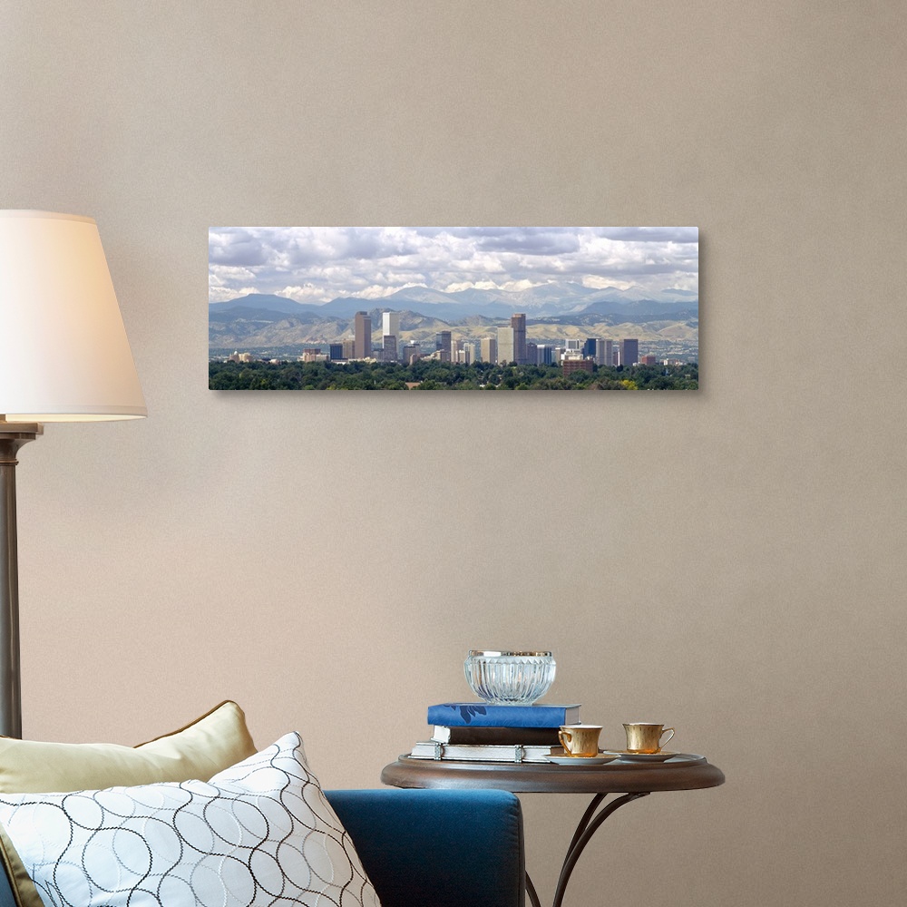 A traditional room featuring Panoramic photograph shows a line of skyscrapers in a capital city within the Midwestern United S...