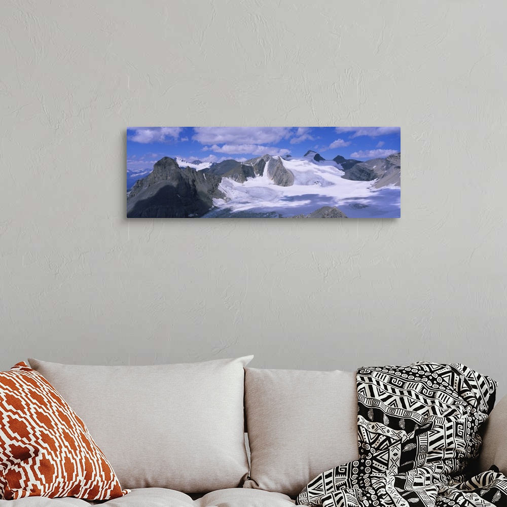 A bohemian room featuring Clouds over snow covered mountains, Canadian Rockies, Banff National Park, British Columbia, Canada
