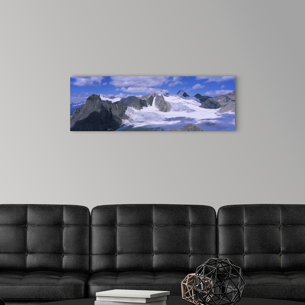 A modern room featuring Clouds over snow covered mountains, Canadian Rockies, Banff National Park, British Columbia, Canada