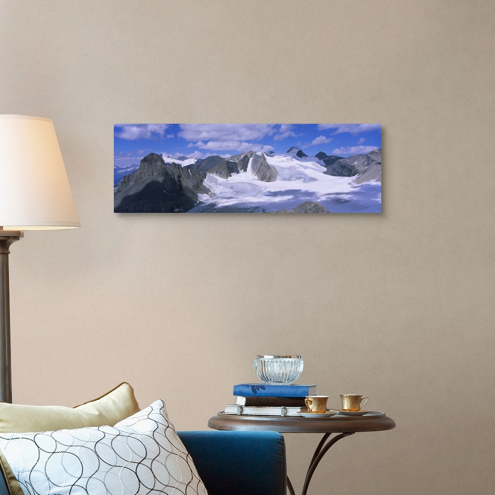 A traditional room featuring Clouds over snow covered mountains, Canadian Rockies, Banff National Park, British Columbia, Canada