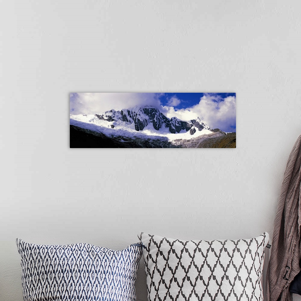 A bohemian room featuring Clouds over snowcapped Andes, Cusco Region, Peru, South America