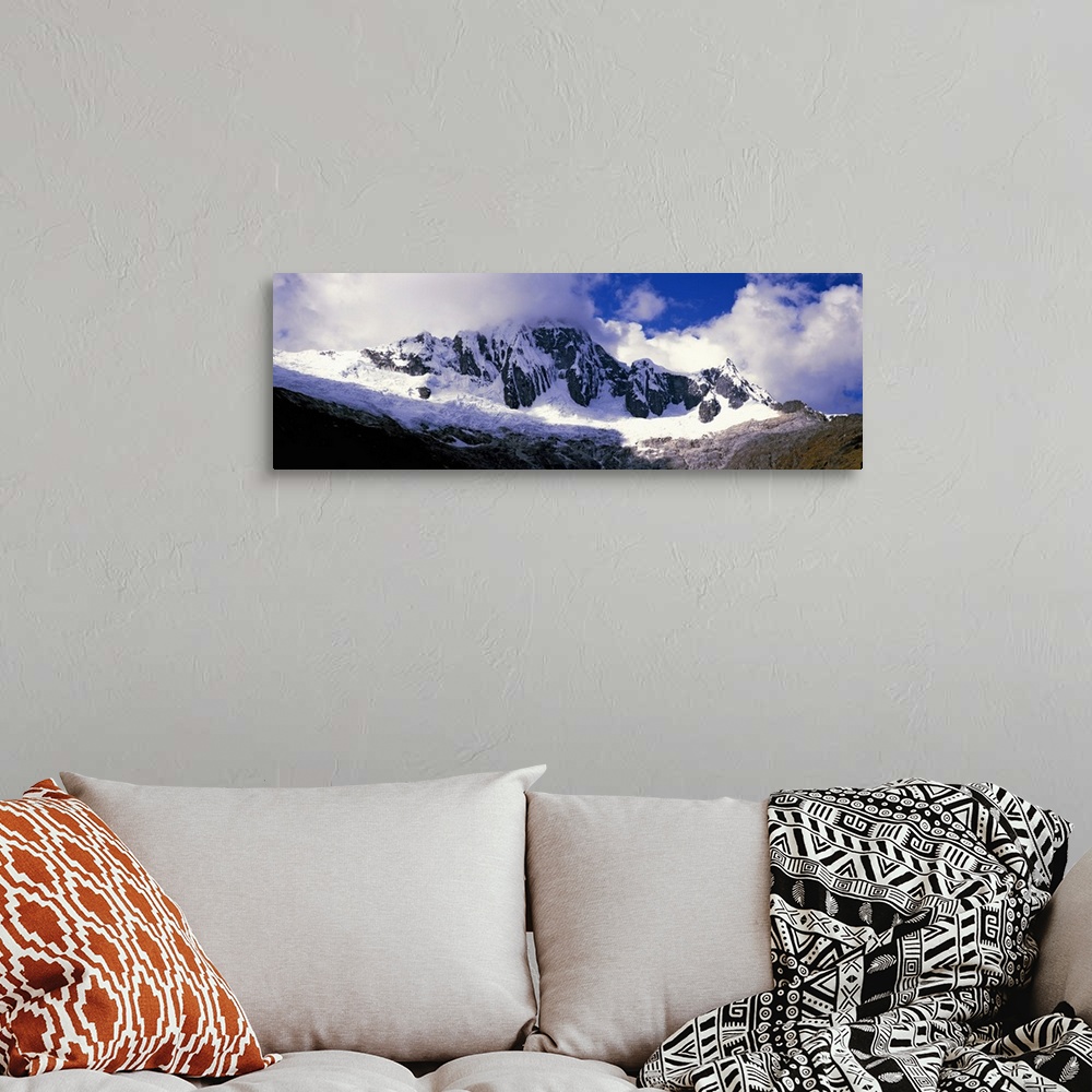 A bohemian room featuring Clouds over snowcapped Andes, Cusco Region, Peru, South America