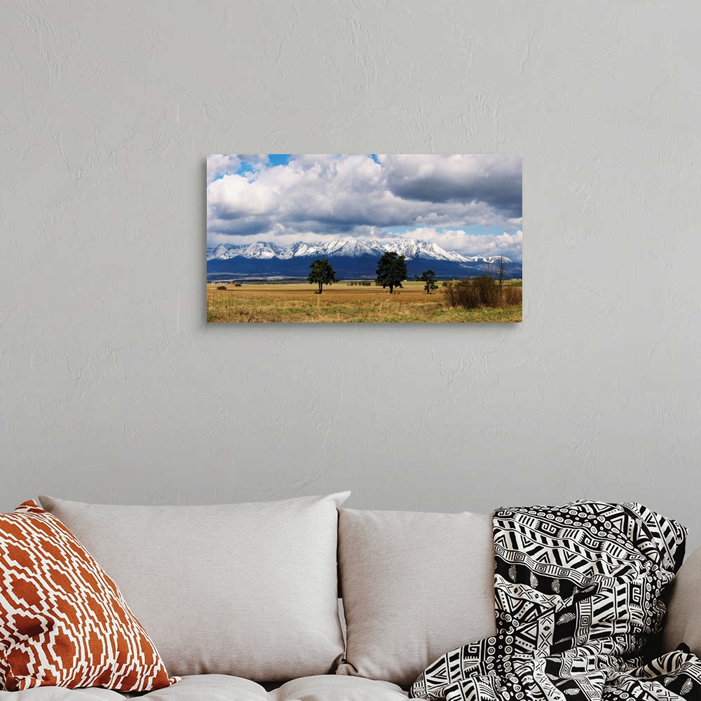 A bohemian room featuring Clouds over snowcapped mountains, Tatra Mountains, Slovakia