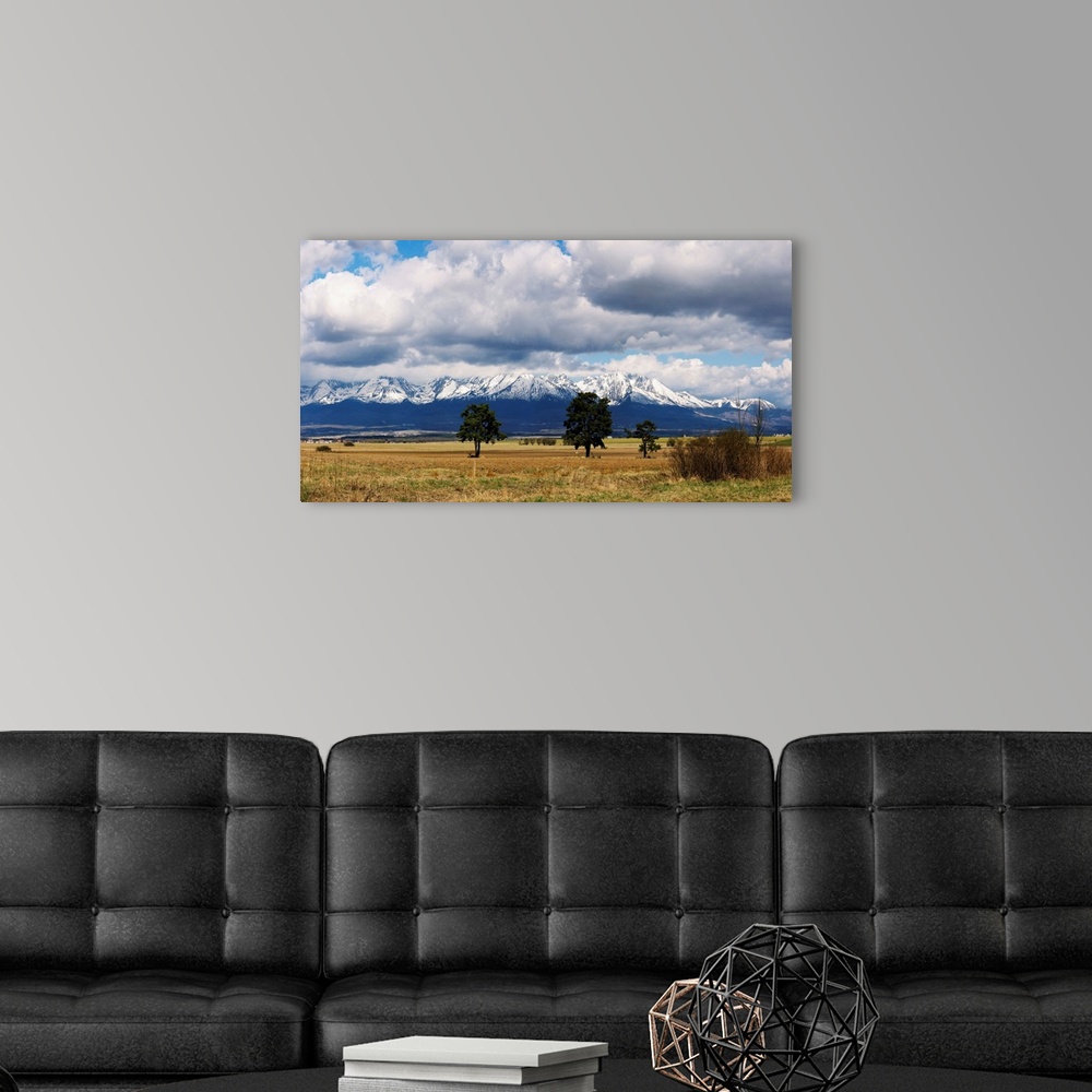 A modern room featuring Clouds over snowcapped mountains, Tatra Mountains, Slovakia