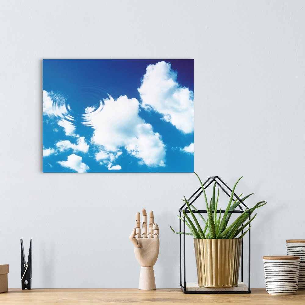 A bohemian room featuring Cloudy blue sky with water ripples