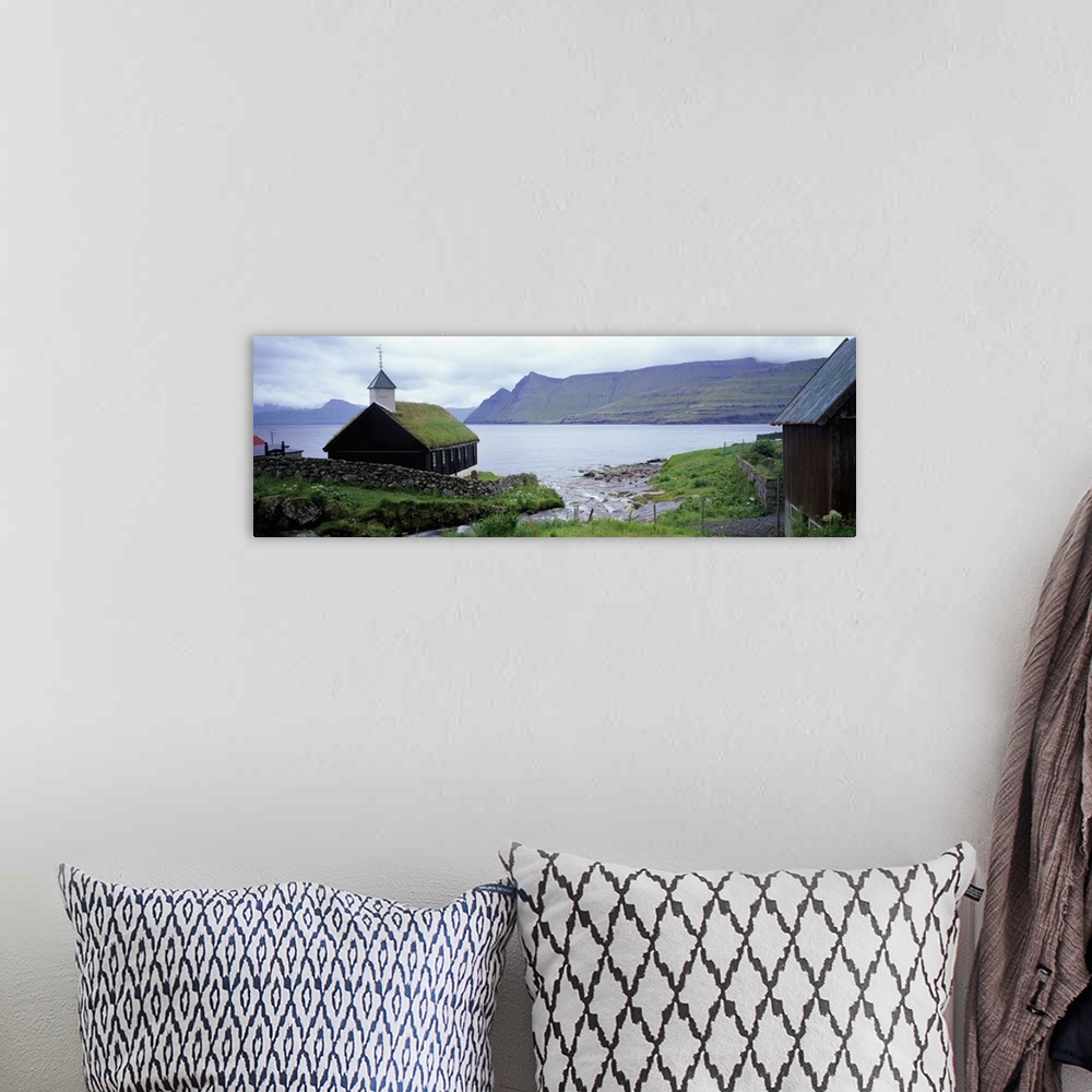 A bohemian room featuring Coastal church with grass roof, Faroe Islands