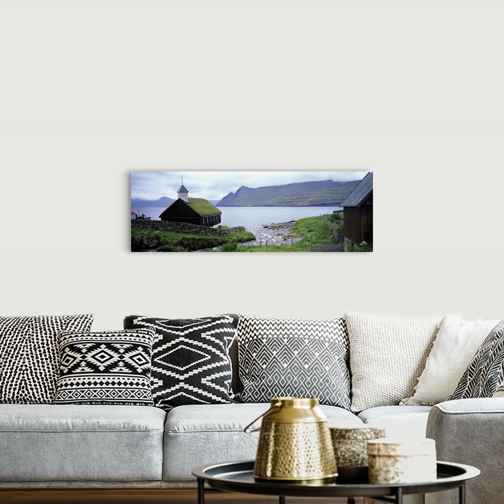 A bohemian room featuring Coastal church with grass roof, Faroe Islands