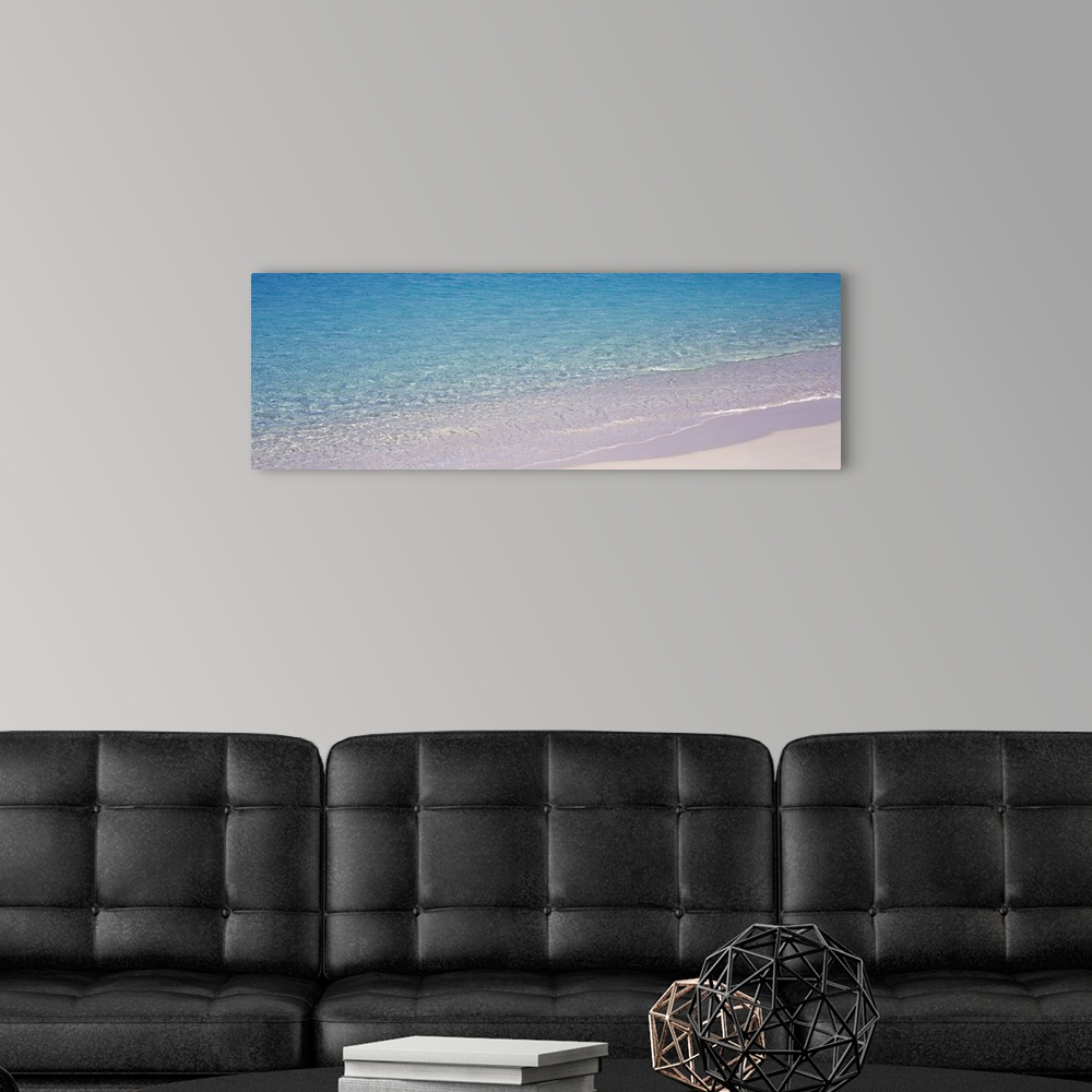 A modern room featuring Panoramic photograph of the clear blue waters reaching the coast of St. John in the U.S. Virgin I...