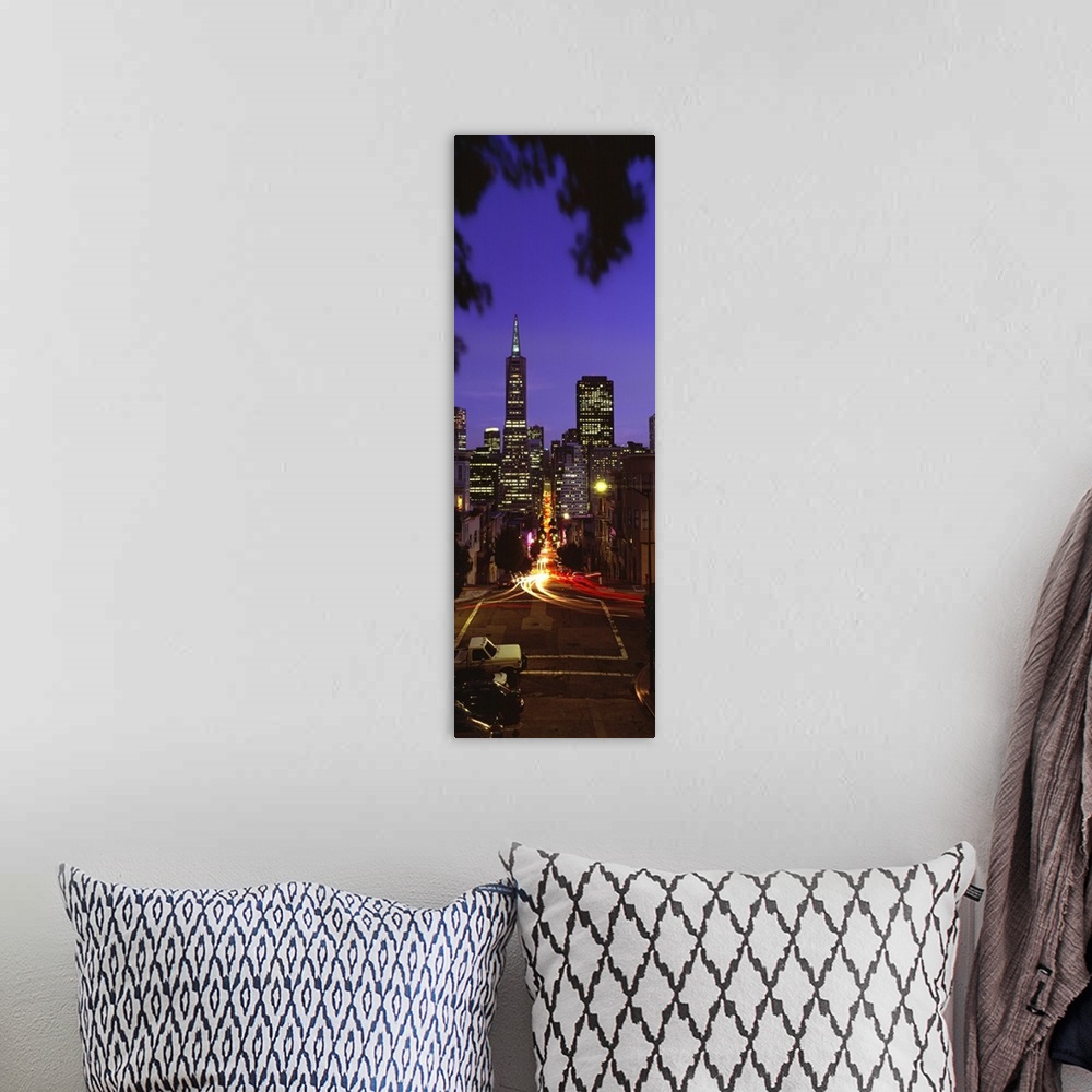 A bohemian room featuring Colonial building light-up at night, Transamerica Pyramid And Columbus Tower, San Francisco, Cali...