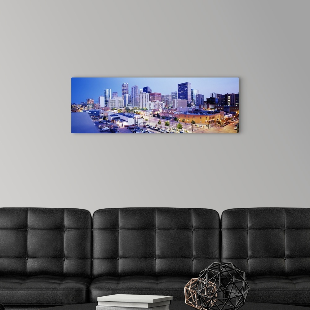 A modern room featuring Panoramic view of a vibrant downtown Denver on canvas.