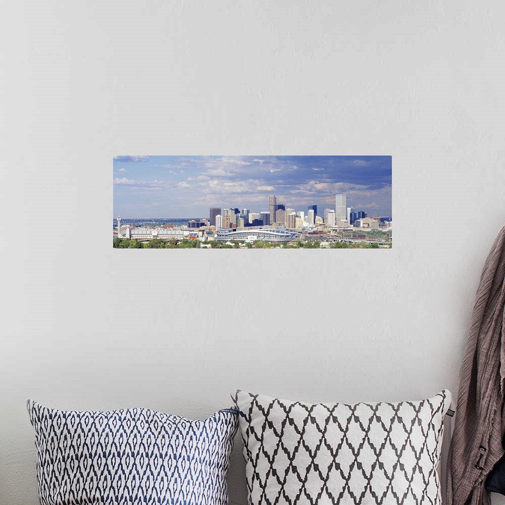 A bohemian room featuring Panoramic view of clouds approaching Denver, CO's Invesco Stadium.