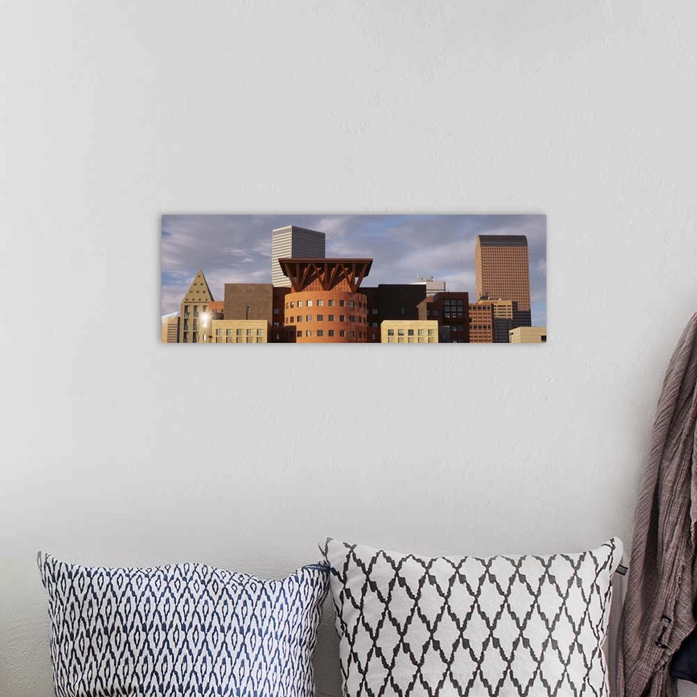 A bohemian room featuring Big, horizontal, close up photograph of the tops of skyscrapers in Denver, Colorado, against a mo...