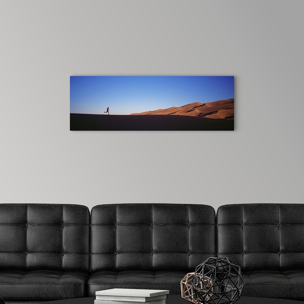 A modern room featuring Colorado, Great Sand Dunes National Monument, Runner jogging in the park