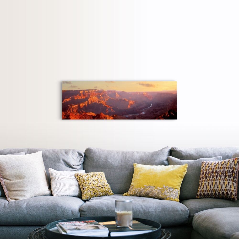 A farmhouse room featuring Panoramic photograph of gorge with a stream running through the base.  There is fog with only a f...