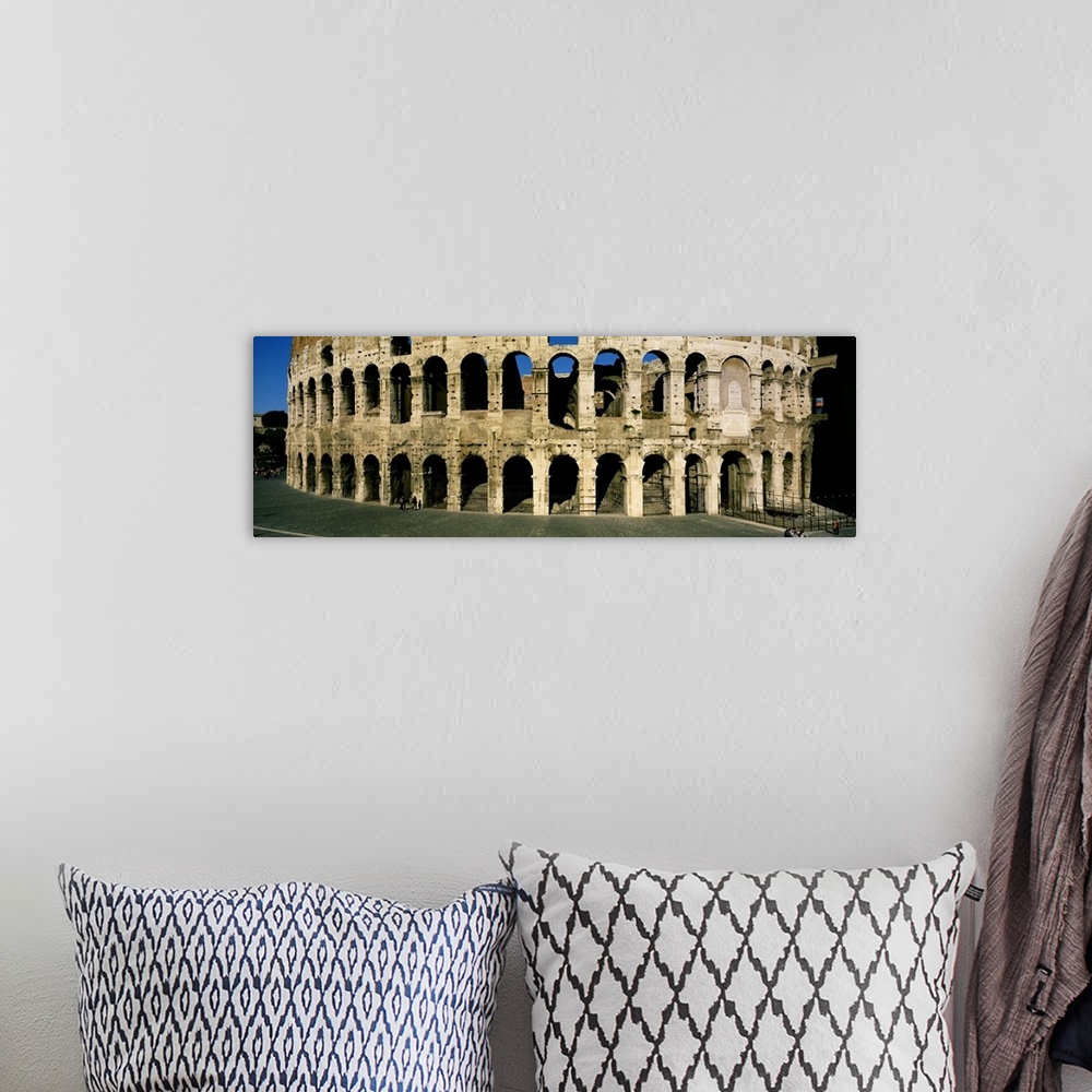 A bohemian room featuring Panorama of the Roman Colosseum with detail of the arches.