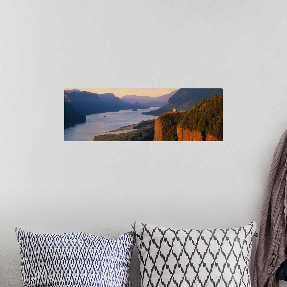 A bohemian room featuring Panoramic canvas photo of a wide river flowing through rolling mountains and cliffs.