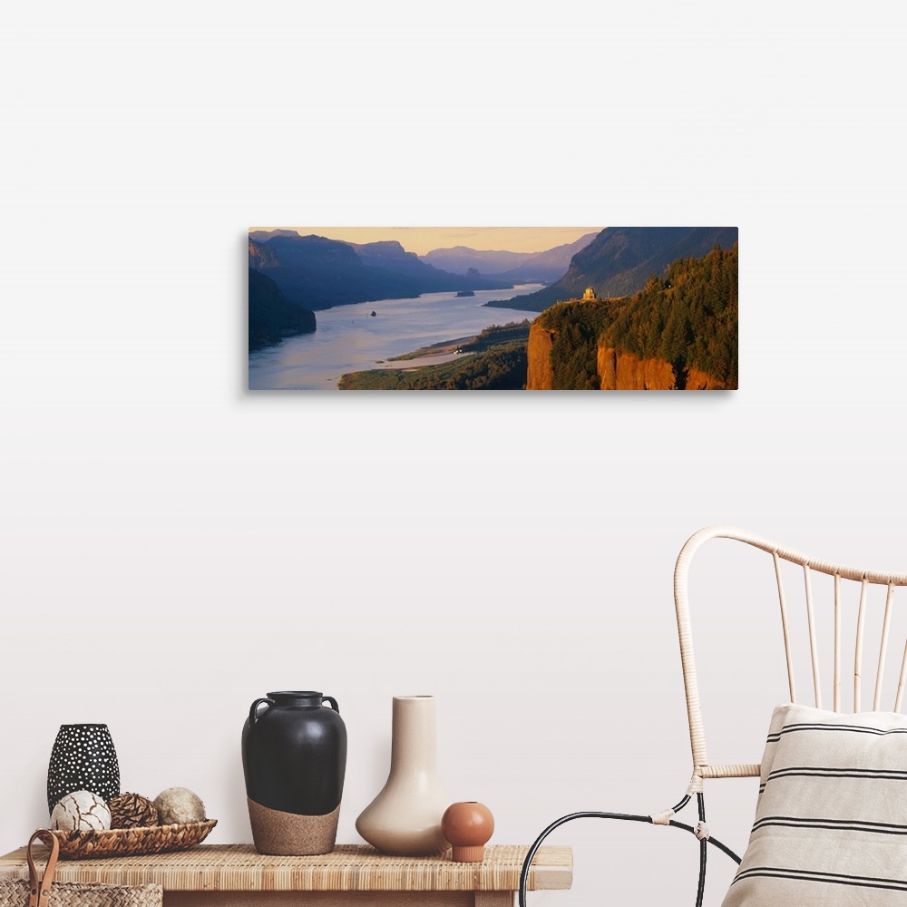 A farmhouse room featuring Panoramic canvas photo of a wide river flowing through rolling mountains and cliffs.