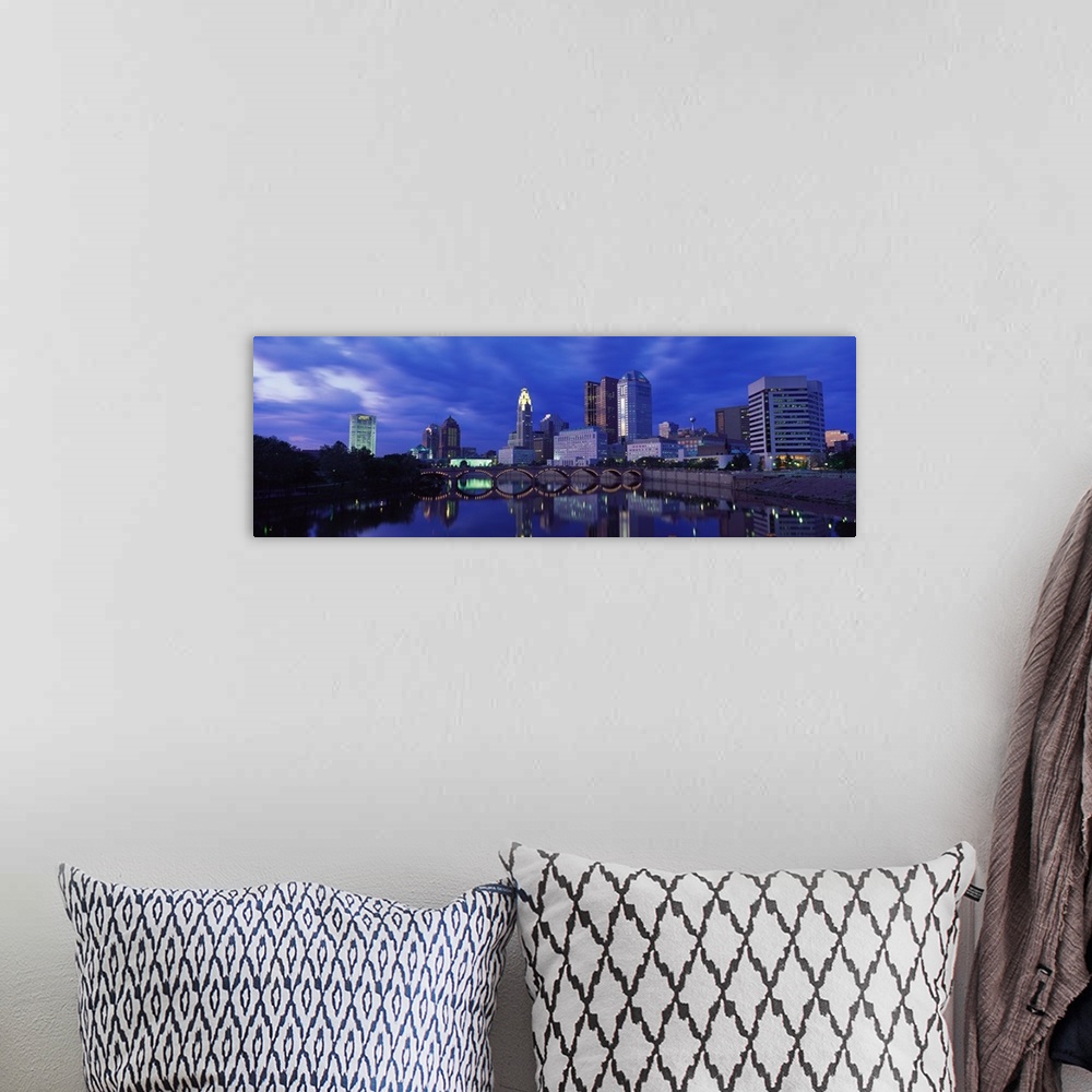 A bohemian room featuring Panoramic photo of downtown Columbus, Ohio with the tall buildings and lit  up bridge reflecting ...