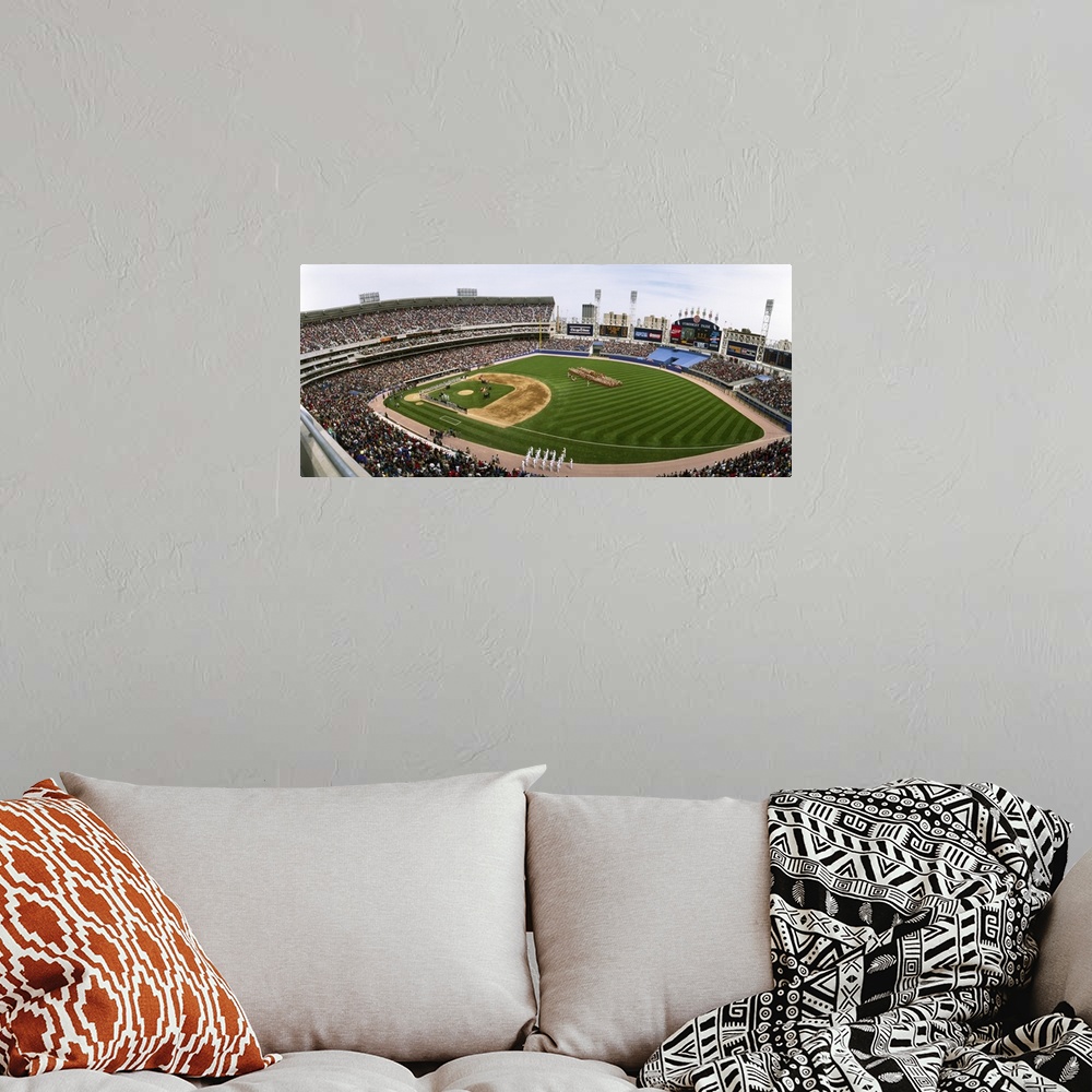 A bohemian room featuring Large image print of a packed baseball stadium in Illinois with a game about to start.