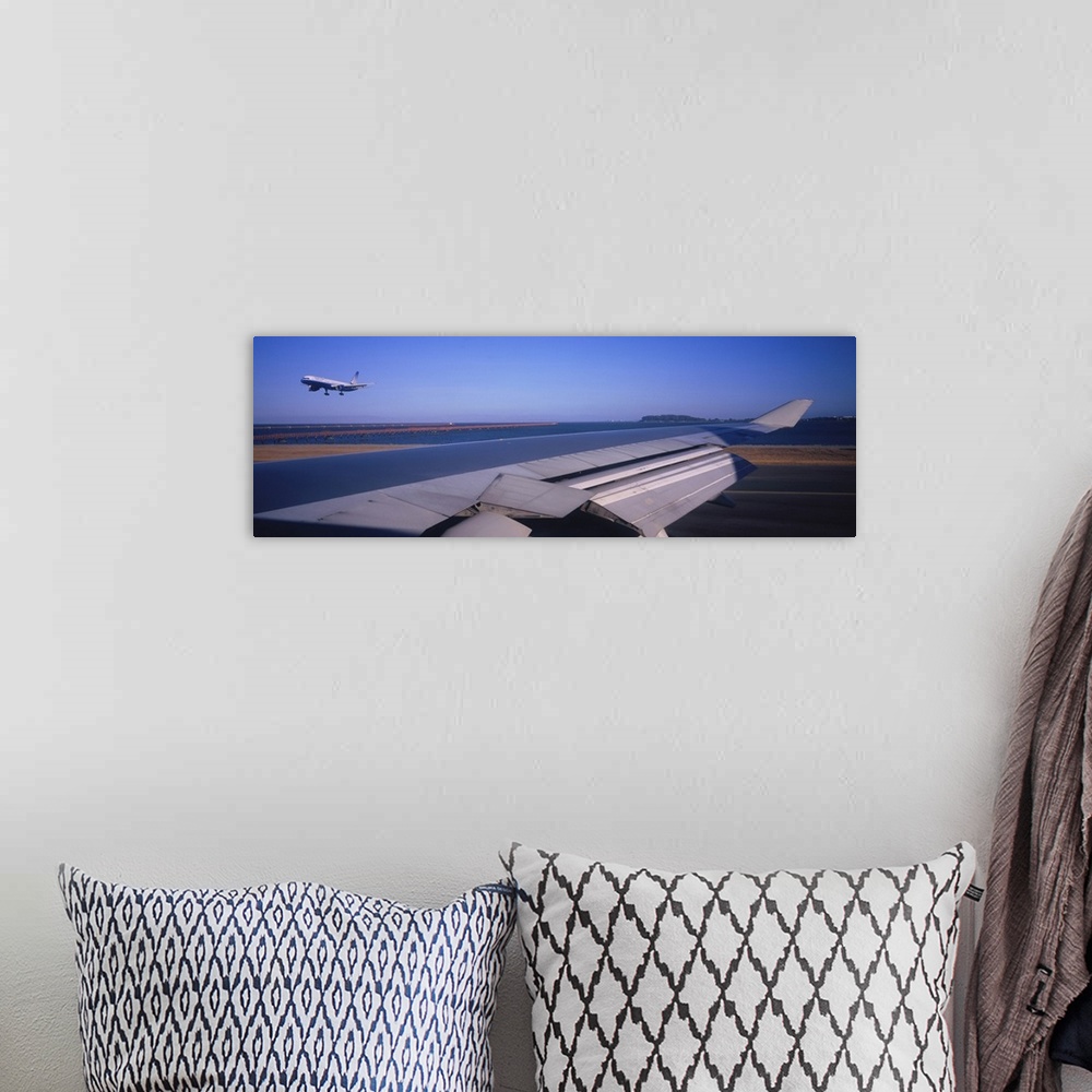 A bohemian room featuring Commercial airplane taking off from a runway, San Francisco, California