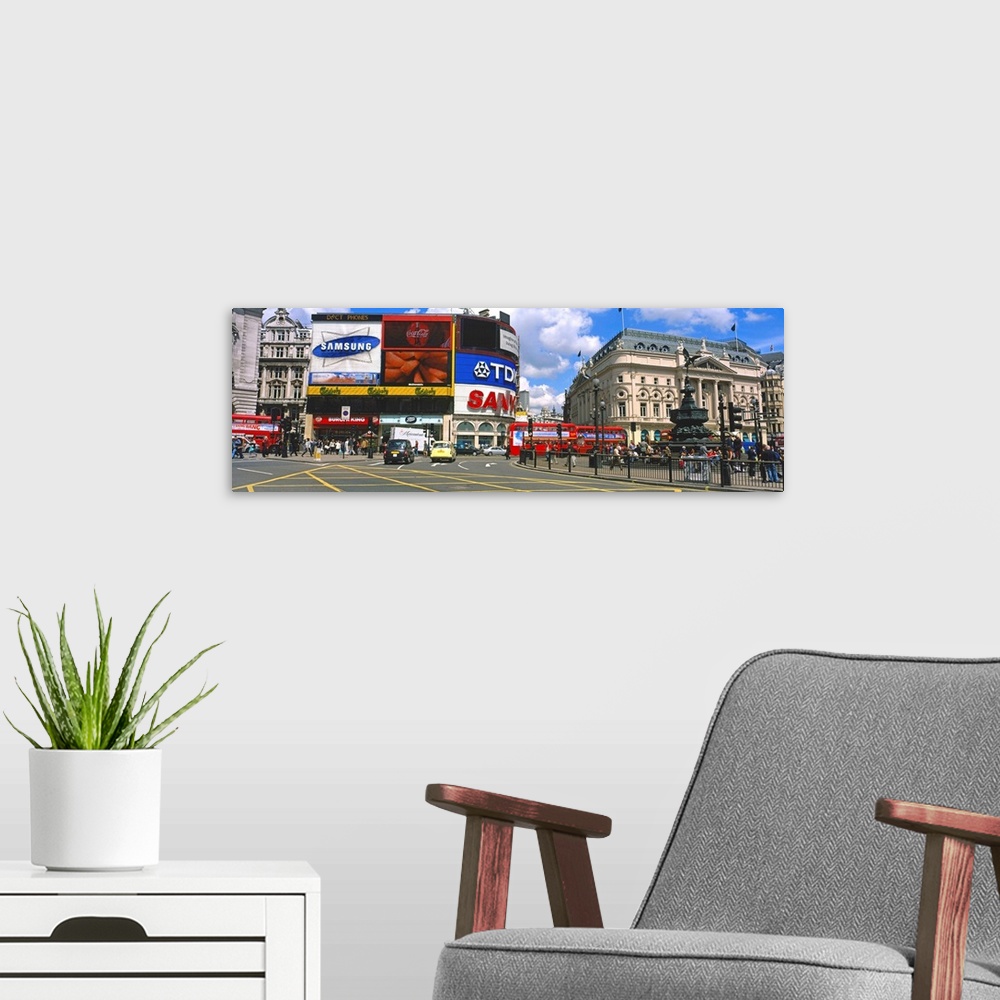A modern room featuring Commercial signs on buildings, Piccadilly Circus, London, England