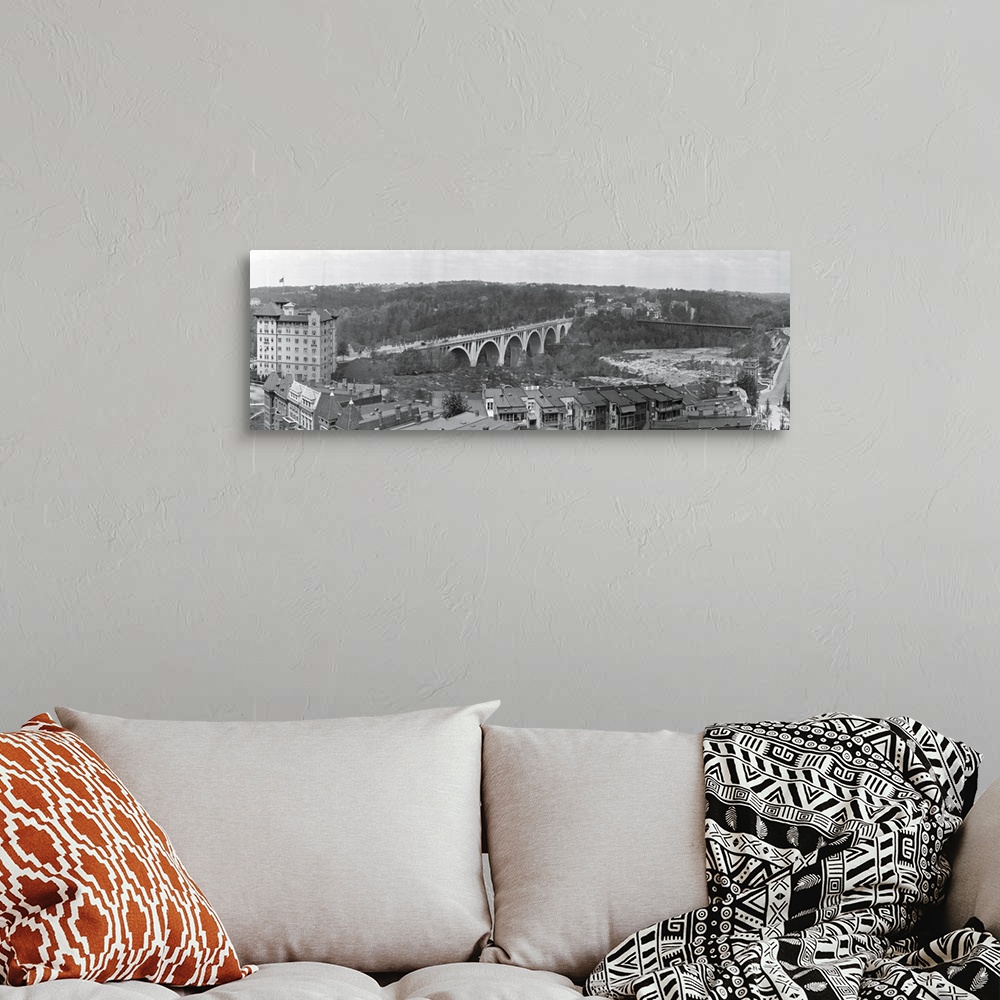 A bohemian room featuring Narrow and horizontal canvas of a bridge going through the District of Columbia.
