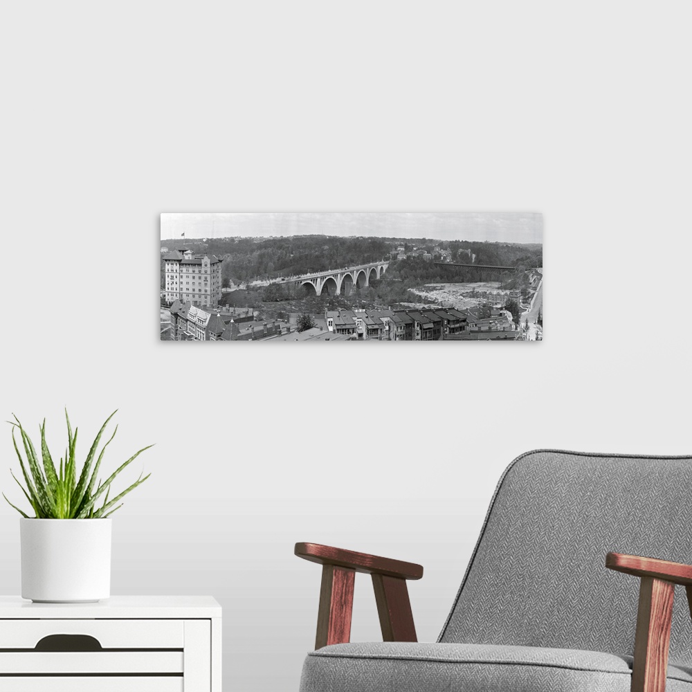 A modern room featuring Narrow and horizontal canvas of a bridge going through the District of Columbia.