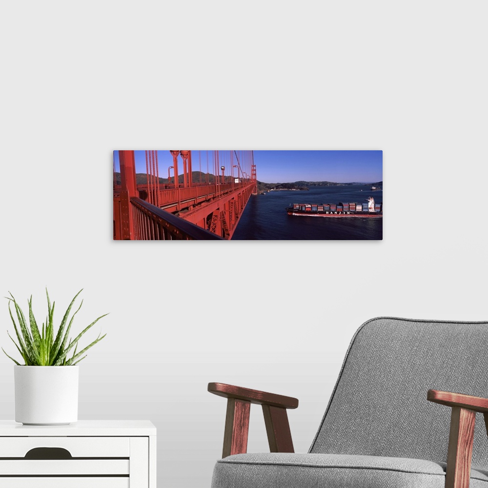 A modern room featuring Container ship passing under a suspension bridge Golden Gate Bridge San Francisco Bay San Francis...