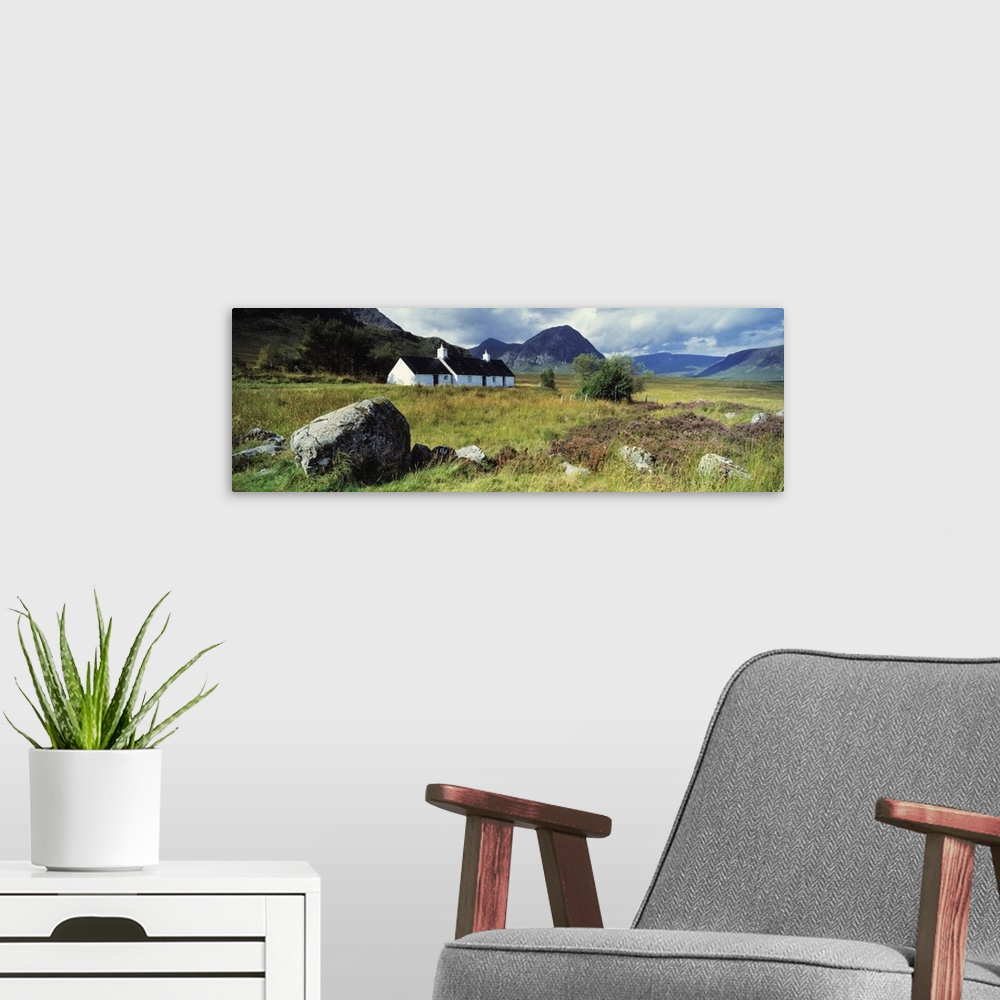 A modern room featuring Cottage on a landscape, Black Rock Cottage, Buachaille Etive Mor, Rannoch Moor, Highlands Region,...